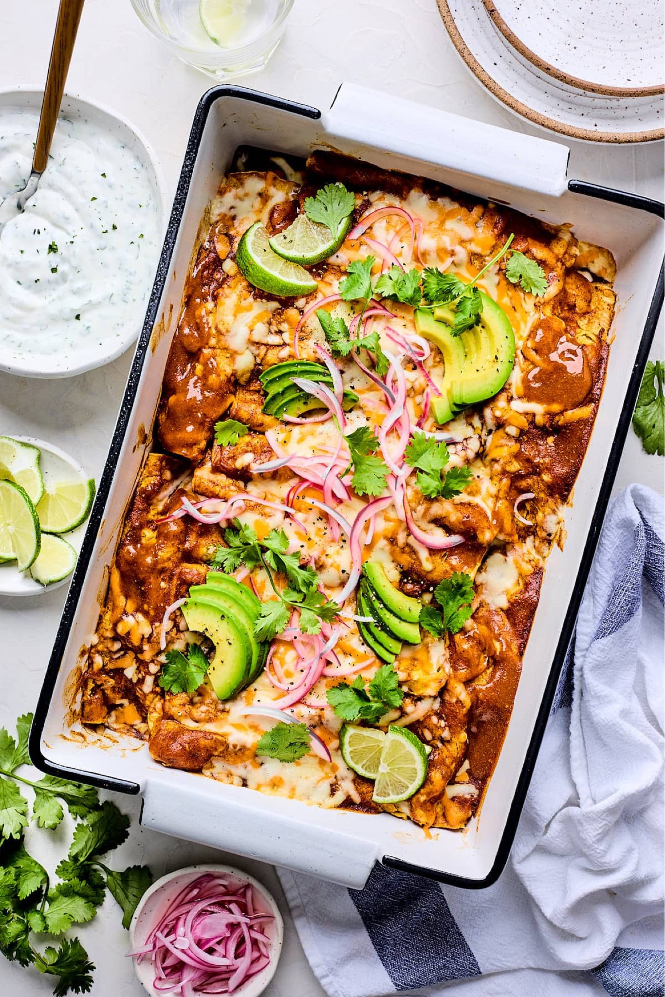 Roasted Cauliflower Enchiladas- corn tortillas are filled with roasted cauliflower, chickpeas, enchilada sauce, and cheese and then smothered with extra enchilada sauce and cheese and baked until bubbly. Serve with lime crema and your favorite toppings for a satisfying vegetarian meal. Full recipe on my blog at TwoPeasAndTheirPod.com

#LTKSeasonal #LTKFindsUnder100 #LTKHome