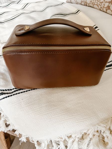 This pleather travel makeup bags has all kinds of room and compartments to put all of your things  

#LTKtravel #LTKFind #LTKfamily