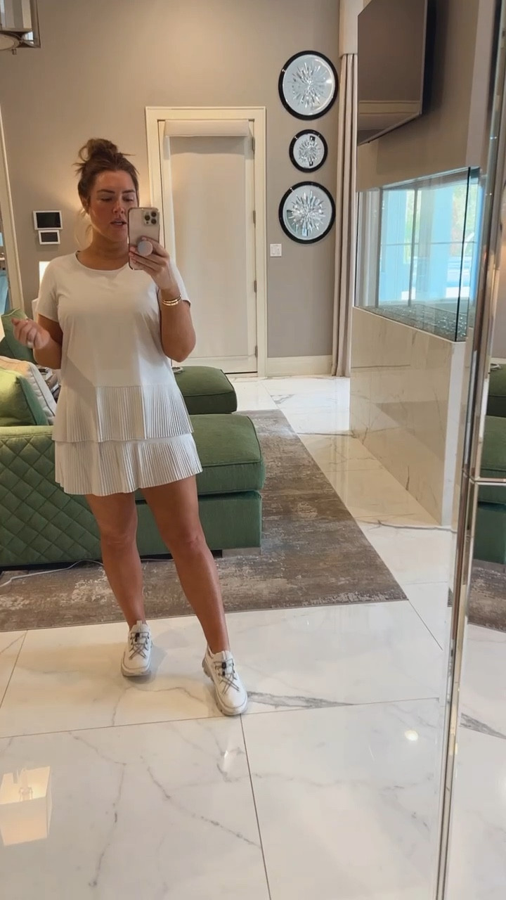 Spanx athletes your top and tennis skort. I am wearing a size large in the top and in the skirt. They fit TTS. 