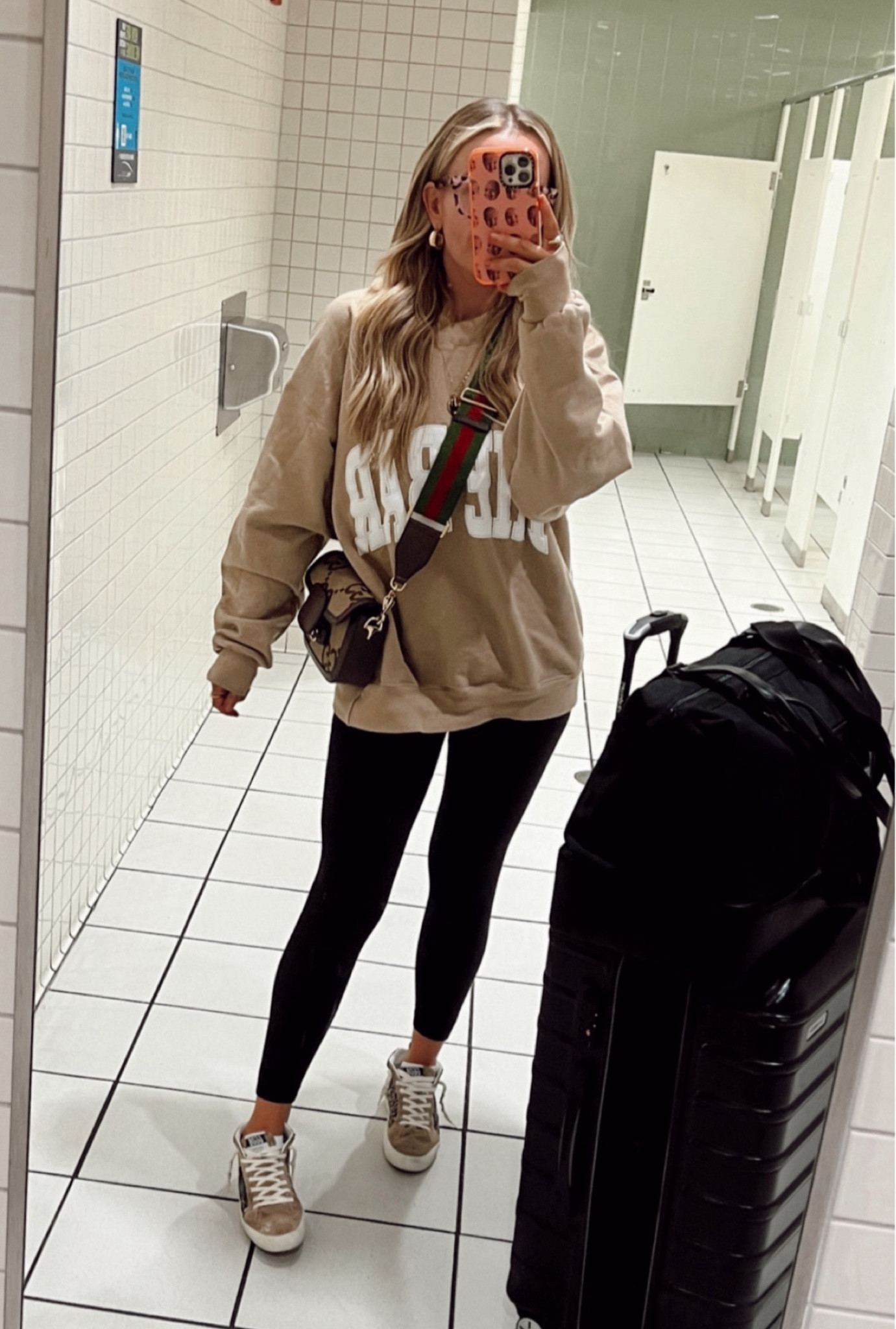 Travel outfit. Bar Sweatshirt, Lululemon Align Bodysuit, Golden Goose 

Carry on bag: Beis