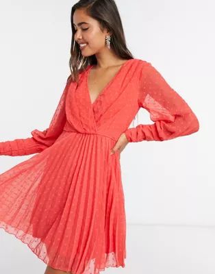 ASOS DESIGN pleated wrap mini dress in dobby spot with pin tuck sleeves in red | ASOS (Global)