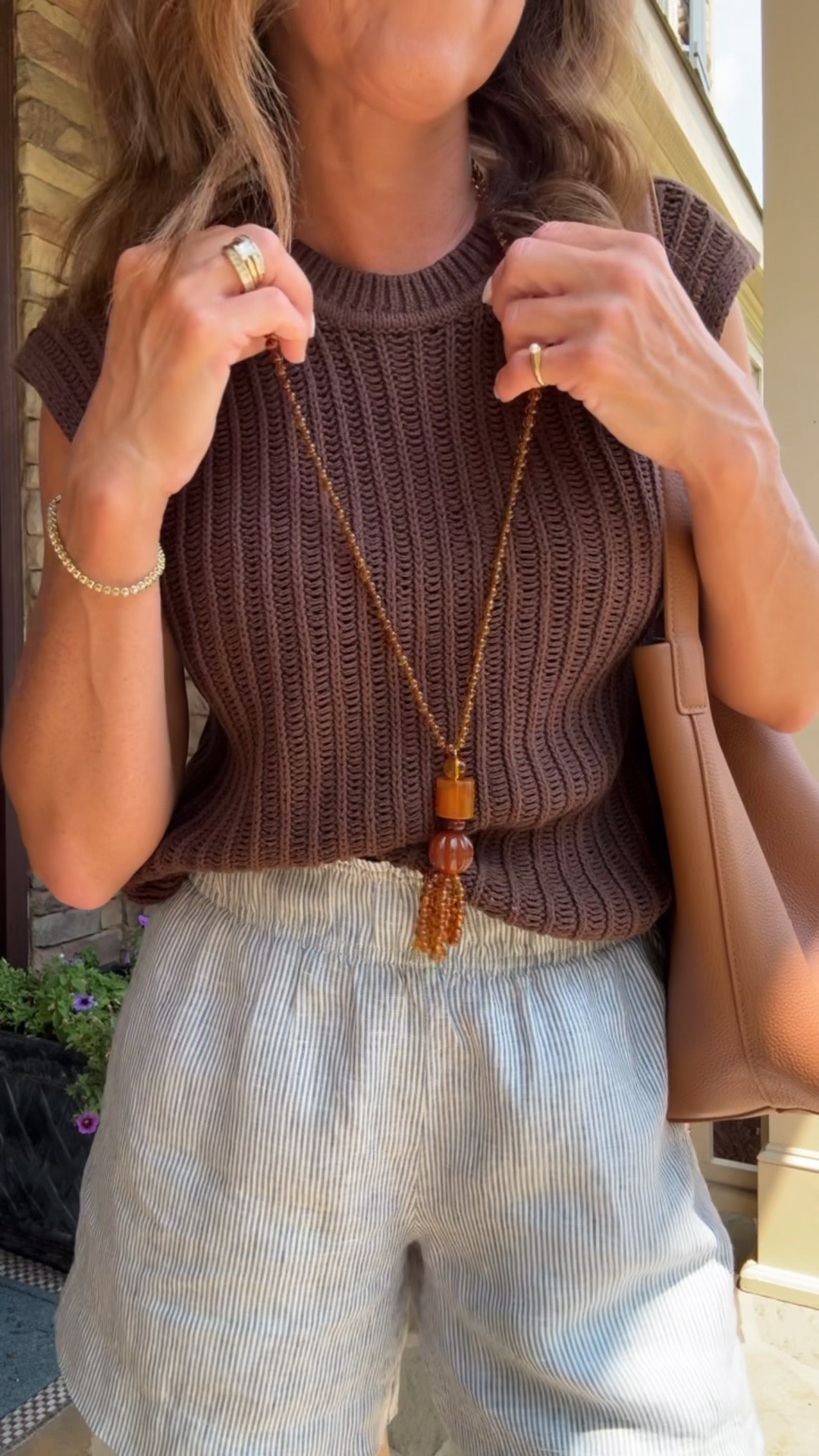 Beaded tassel necklace. Summer sleeveless sweater. Linen shorts

#LTKootd #LTKSeasonal #LTKOver40