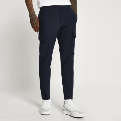 Details
Elasticated waistband Side pocketsFront slip pocketsCargo styleButton and zip fasteningO... | River Island (UK & IE)