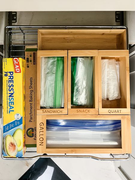 Bamboo organizers for plastic storage bags are my favorite way to organize this type of storage.  They are also available for aluminum foil and plastic wrap.  I also added a wire pull out shelf to this cabinet to help maximize storage.

#LTKhome #LTKfamily #LTKFind