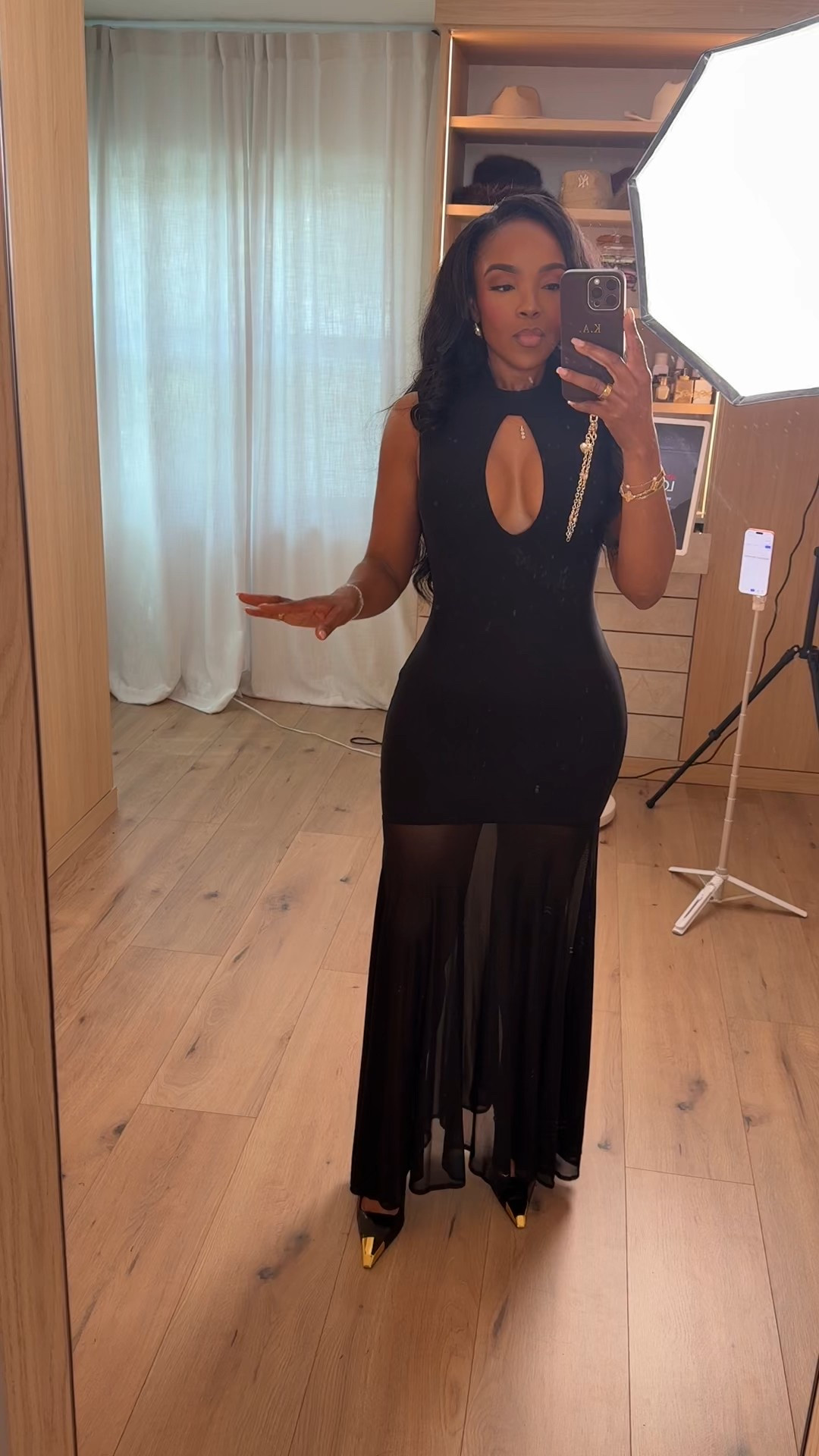 All black, all confidence 🖤 This fitted cutout maxi dress is the definition of elevated minimal. The sculpted bodice highlights the waist while the sheer flowy hem adds movement and drama — and because it’s a timeless black statement piece, the cost per wear keeps dropping every time you restyle it.

Pair it with pointed heels for evening, layer with a blazer for events, or switch to strappy sandals for vacation nights. It’s one of those dresses that instantly makes you feel put together.

Perfect for: formal dinners, birthday celebrations, date night, cocktail events, weddings, and upscale evening plans.

📏 Sizing:
Wearing size Small  

📐 Measurements:
5’4” · 138 lbs · 34D · 27” waist · 40” hips  

Save this post for your next event look.

This post includes black maxi dress outfit, cutout evening dress, sheer hem dress, elegant night out look, formal event outfit, vacation dinner outfit, chic monochrome styling, and statement black dress.

Follow me on Instagram and YouTube @kirasfashionfind