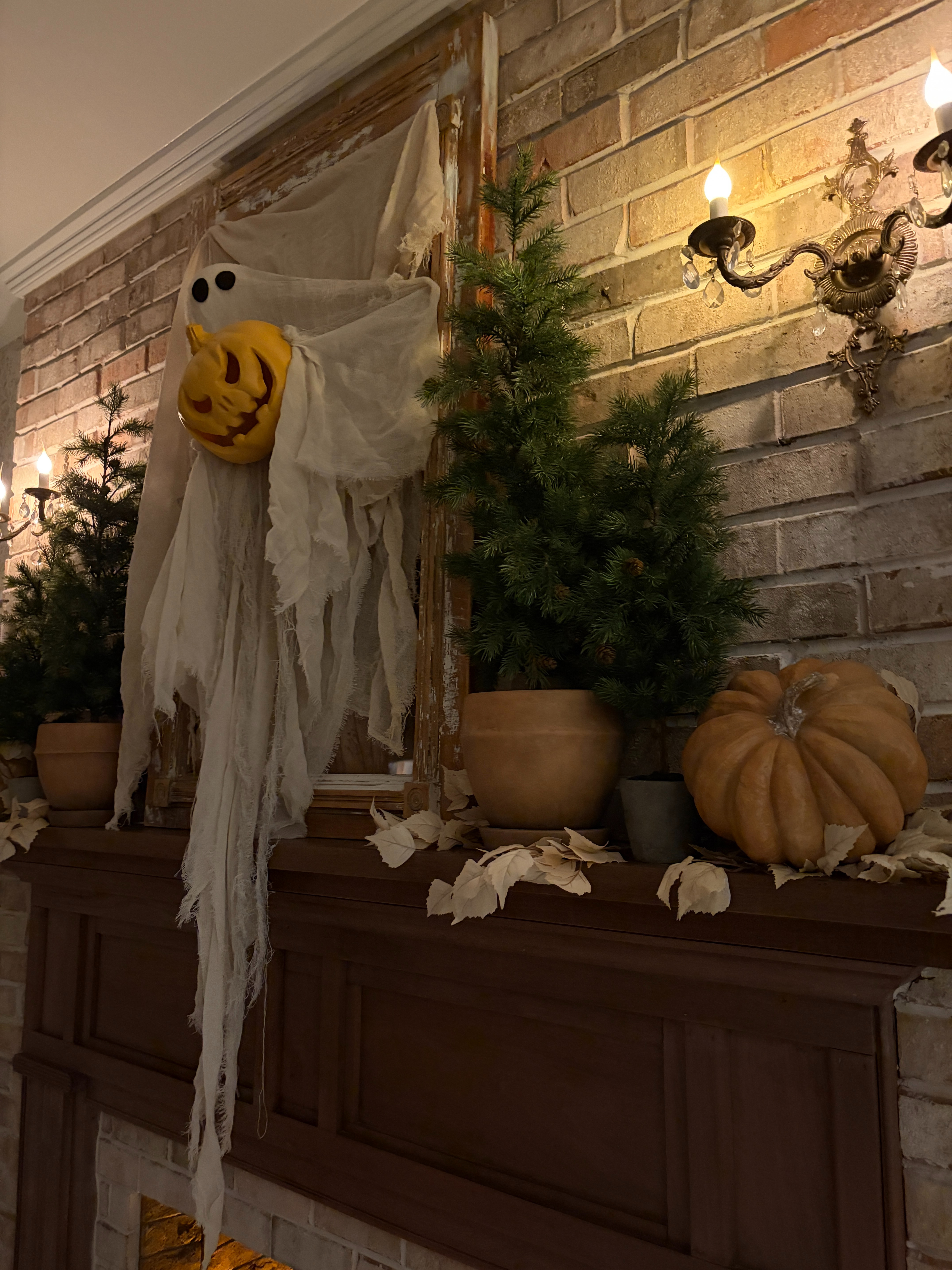 I added this ghost holding a pumpkin to a vintage frame above our fireplace mantel and I love the neutral Halloween vibe.  

 #LTKSeasonal #LTKHome