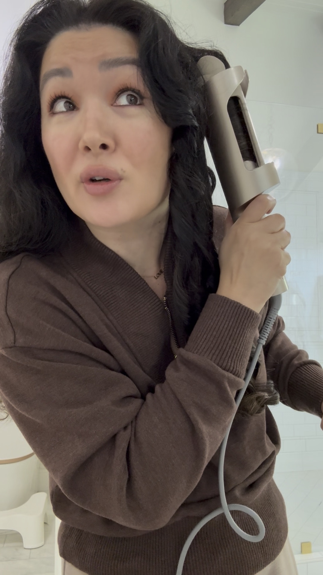 Automatic curling wand, you can switch the rotation with a flip of a button so you can curl away from your face. I am not a hair person and this is legit so easy. 