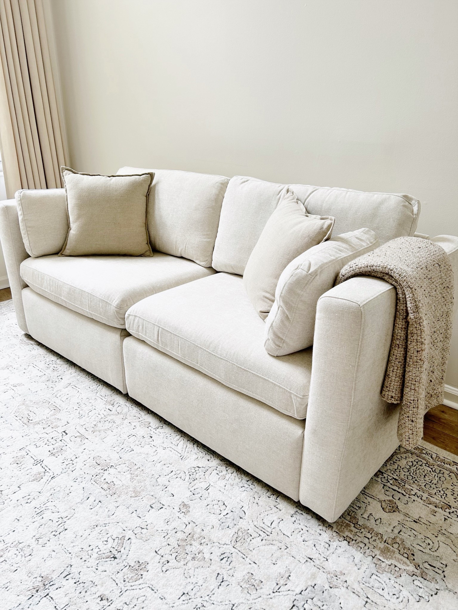 Just got a new couch. This space has been pretty empty for over a year. Going to start brainstorming something for the wall to add color.  

Curtains are the Isabella by Twopages in the color Seed pearl  

#LTKHome #LTKFindsUnder100 #LTKFindsUnder50