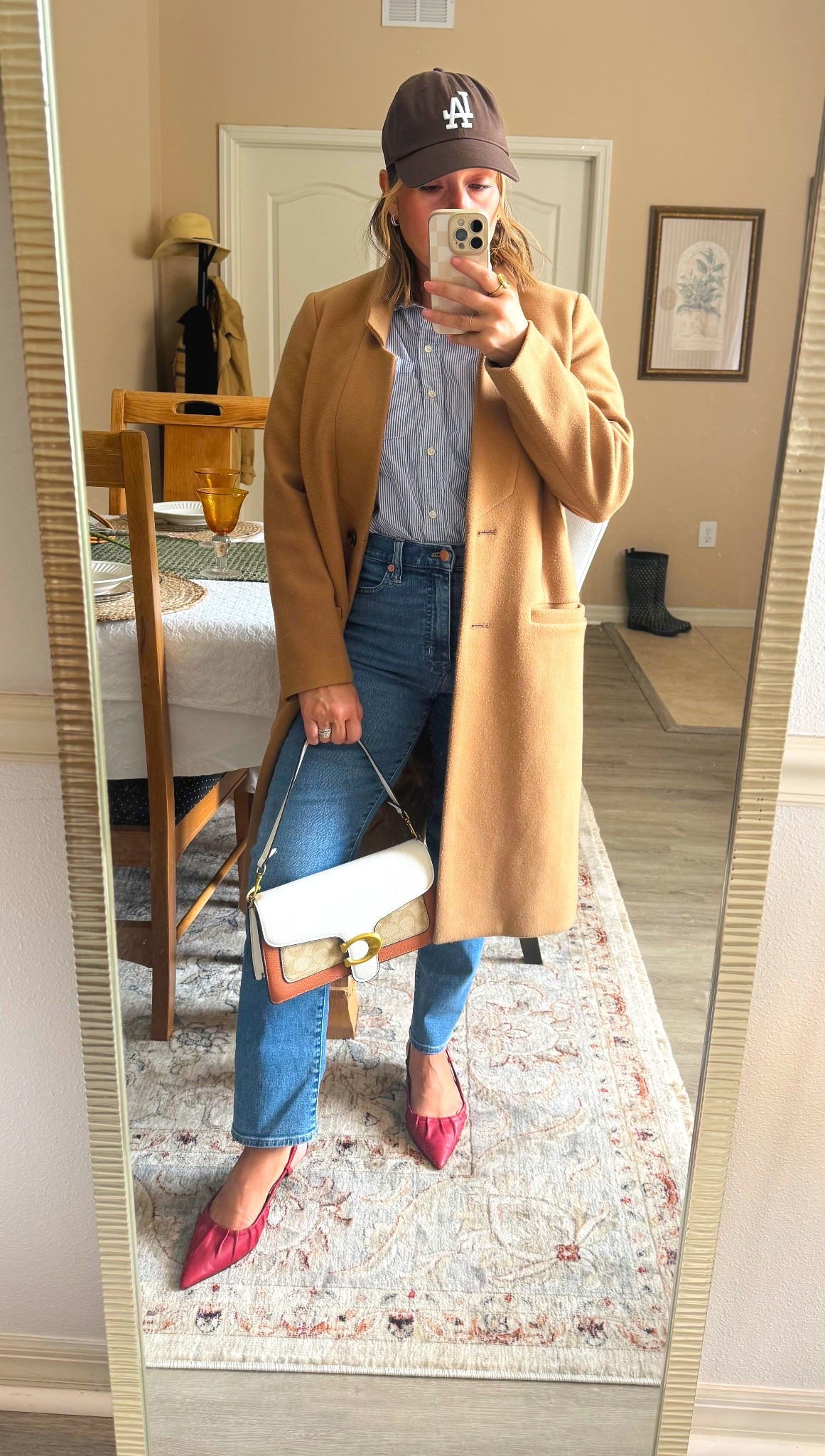 I layered a classic camel coat over a striped button-down and straight-leg denim, then added a sporty LA cap for balance. To polish it up, I grabbed my color-block shoulder bag and finished the look with these statement red slingbacks. Perfect for coffee runs, casual Fridays at the office, or weekend outings where you want to look put-together but not overdone.

#LTKSeasonal #LTKPetite #LTKFallSale