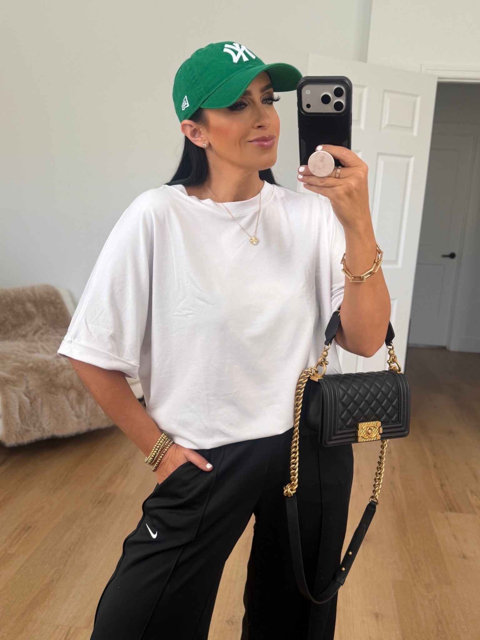 Nike Sportswear Women's Mid-Rise Wide-Leg Track Pants. White tshirt wearing size medium. 