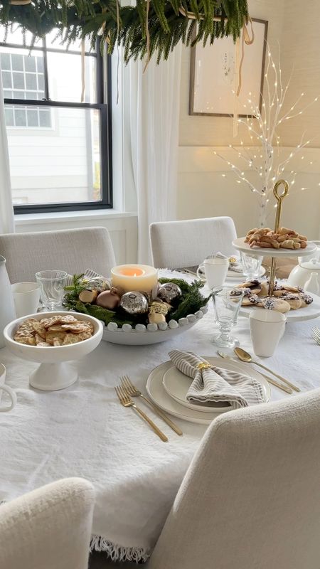 Neutral, gold, white and green Christmas tablescape. White linen table. Throw from pottery barn. Marble serveware. Simple Christmas centerpiece. Gold flatware. Napkin rings, and linen napkins from Amazon 

#LTKHoliday #LTKhome #LTKSeasonal