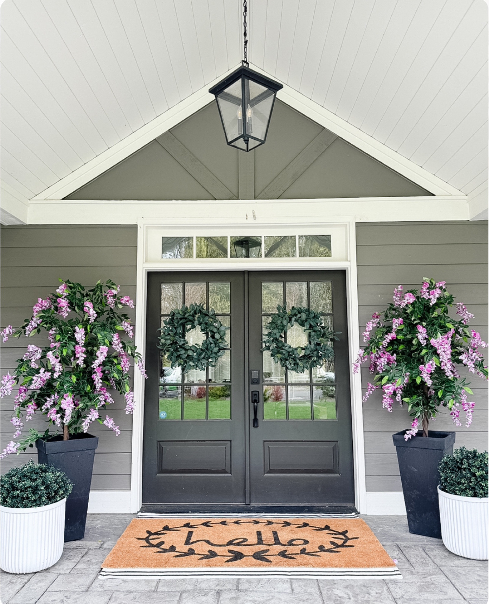 Spring summer front porch idea! Layered rugs and mat, faux wisteria trees, all weather planters!

#LTKHome #LTKStyleTip #LTKSeasonal