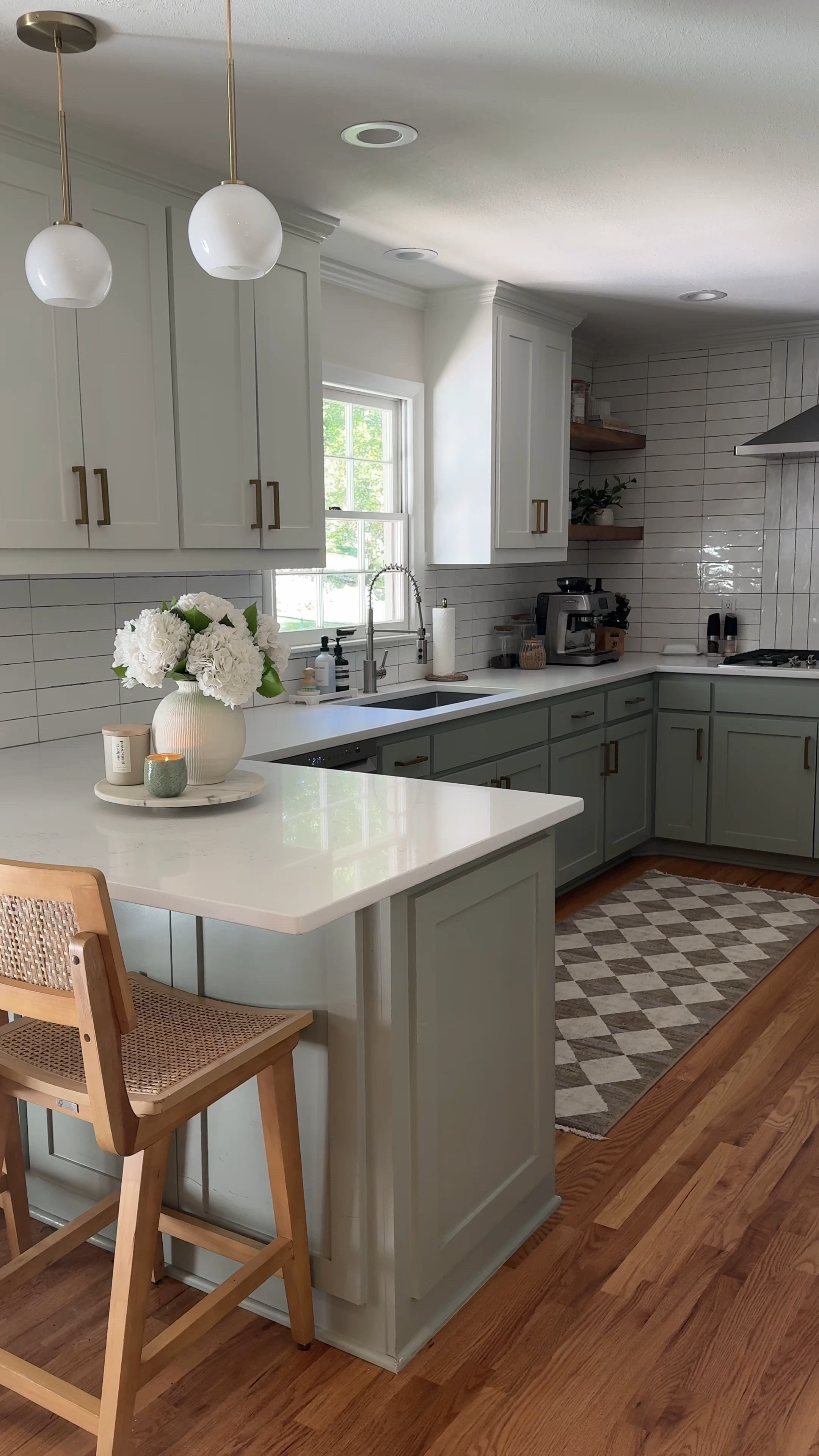 All the kitchen details for my sage blue green kitchen! A lot of my kitchen decor is affordable and linked here! Including my Amazon faux flowers. I love our white counters and two toned cabinets! These barstools are target and so amazing! Color of cabinets: SW Oyster Bay

#LTKHome