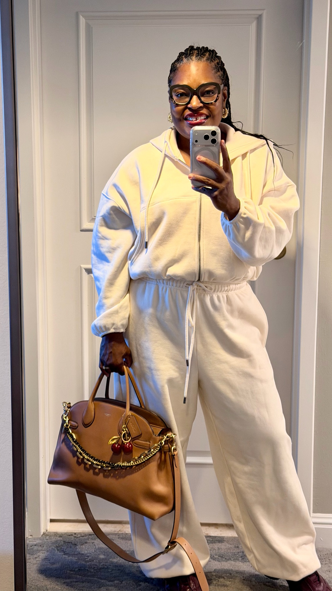 Girl what you wearing today?
Your airport outfit should be just as cute as your outfits in your carryon. This sweatsuit is cute and comfortable!! Winning! Bonus is the quality is superb, I have washed it several times and it still looks fantastic! #ootdfashion #traveloutfit #kbbbykahlana #fyp #styleinspiration  
Sweatsuit@KBB by KAHLANA 
Handbag@Coach 
Sneakers@Nike 
Glasses@Warby Parker 

#LTKdayinmylife #LTKgrwm #LTKootd