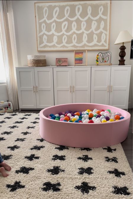Our playroom feels complete with this soft rug and ball pit! We also have the playroom IKEA Brimnes cabinets to hide our toys and a large canvas art I made myself 

#LTKhome #LTKbaby #LTKfamily