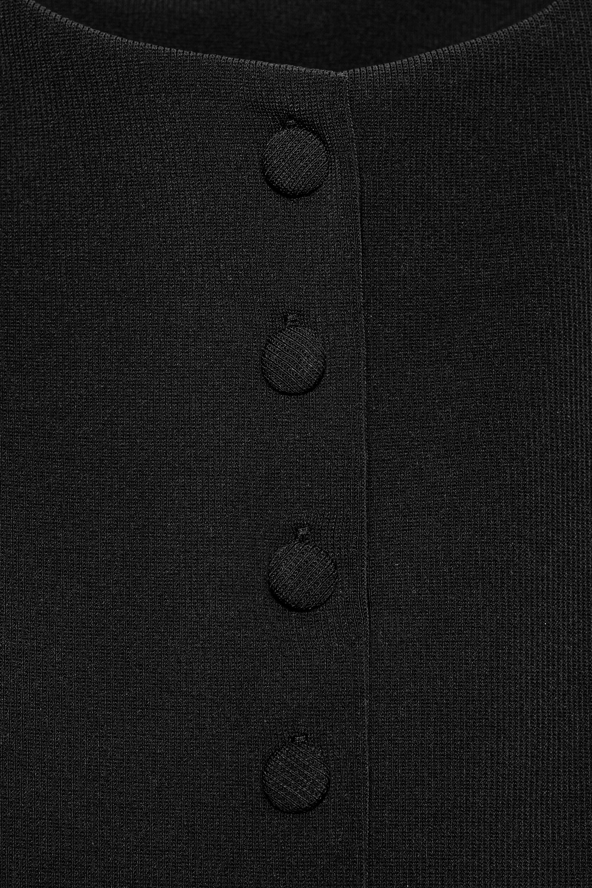 ZARA | Sleeveless vest featuring a round neck. Straight hem. Front closure with matching fabric-covered ... — shop this pick from Emily's edit