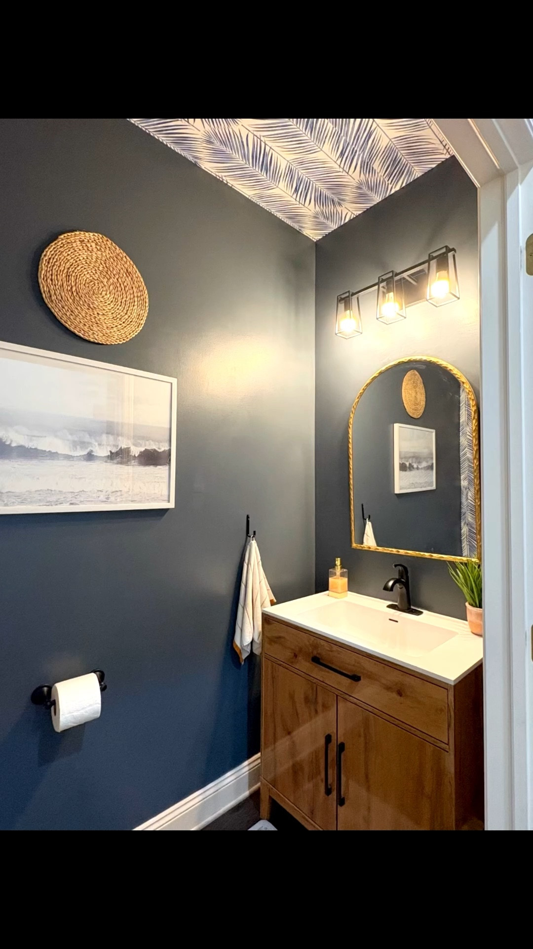 That moody half bath wallpaper fun! Black fixtures with gold accents 🫶🏽🤎🖤

#LTKU #LTKHome