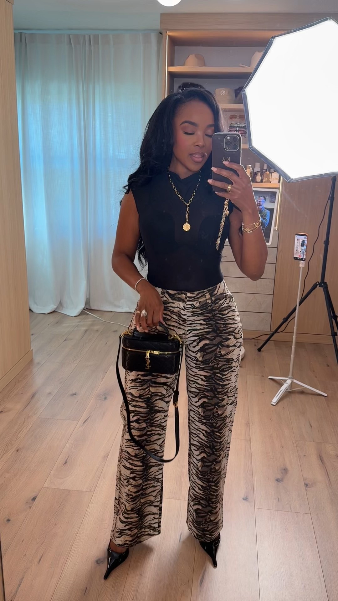 Statement pants, effortless energy 🖤 These zebra print wide leg trousers instantly elevate a simple black sleeveless top. The structured silhouette keeps it polished while the bold print brings personality — and when you style these pants with heels, boots, or even a blazer, the cost per wear keeps dropping.

The fitted top balances the volume of the pants perfectly, and the mini black bag pulls everything together for that elevated night-out feel.

Perfect for: date night, girls’ night, dinner plans, fashion events, rooftop drinks, and bold everyday styling.

📏 Sizing:
Wearing size Small in the top  
Wearing 27 Long in the pants  

📐 Measurements:
5’4” · 138 lbs · 34D · 27” waist · 40” hips  

Save this post to recreate this look later.

This post includes zebra print pants outfit, statement trousers, wide leg pants styling, animal print trend, date night outfits, black sleeveless top outfit, silver hardware accessories, and bold chic fashion.

Follow me on Instagram and YouTube @kirasfashionfinds