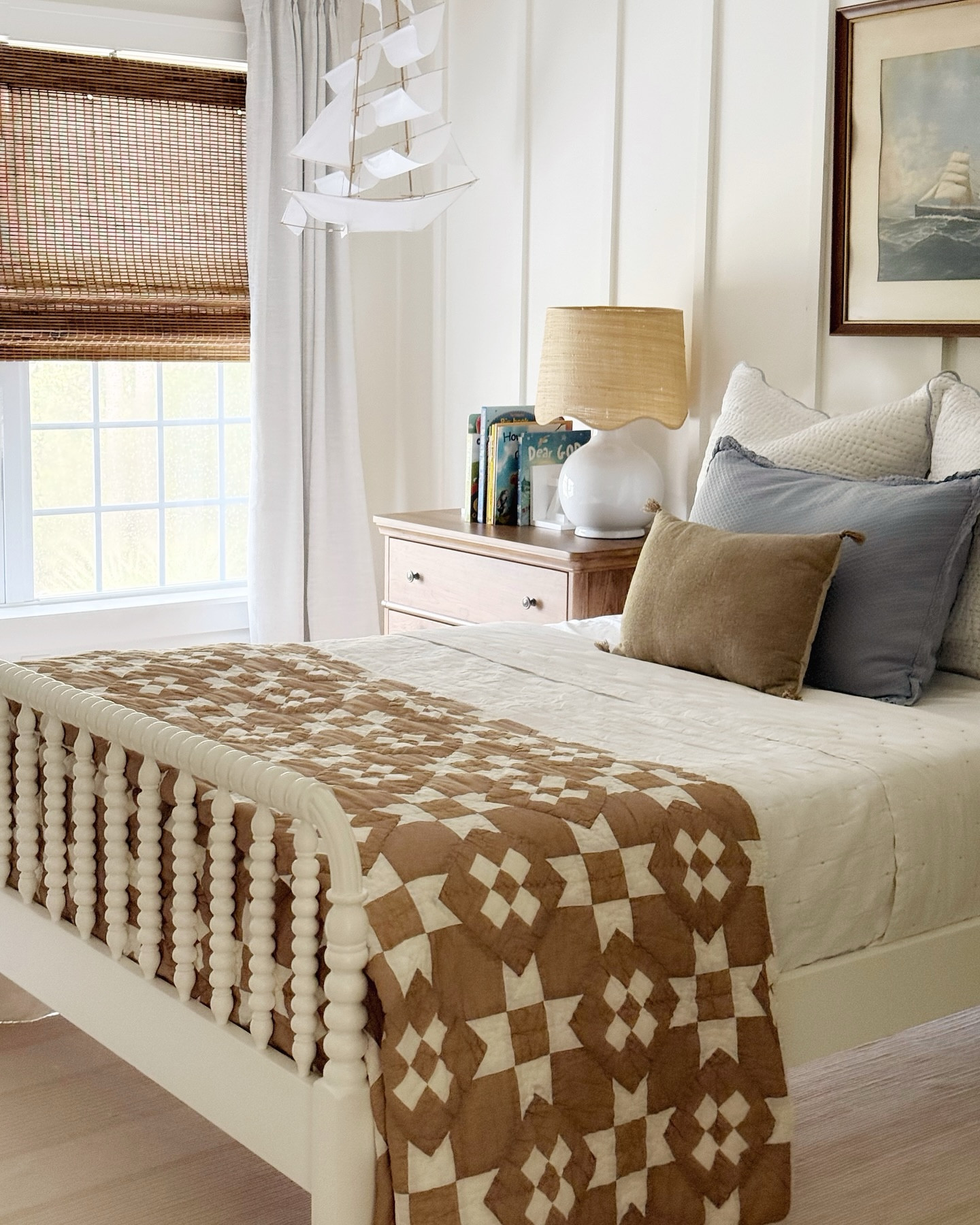 A vintage coastal room with my little man- gosh I’m so glad I collected many of these items over the years! It’s the sweetest little room.

Secondhand items pictured: 
-all of the art and nautical flags
-piano stool
-bed (still available online)
-blue ginger lamp 

Everything else (bedding, rug, curtains, and more) are linked in my @shop.ltk comment SHOP for links! 

#coastalhome #charlestonsc #vintagestyle #vintagehome #cottagestyle