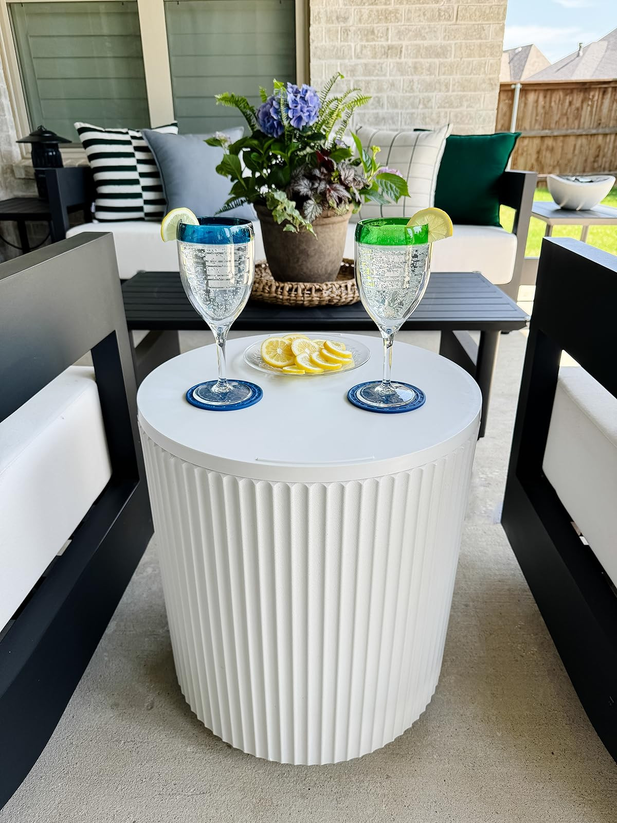 We love this outdoor table that doubles as a cooler! 🌟 The top opens to reveal a cooler or storage space inside! 

#summervibes #furniturecooler #momlife #patioupgrade #neutralhome #neutralpatio

#LTKHome #LTKmorningroutine #LTKSeasonal
