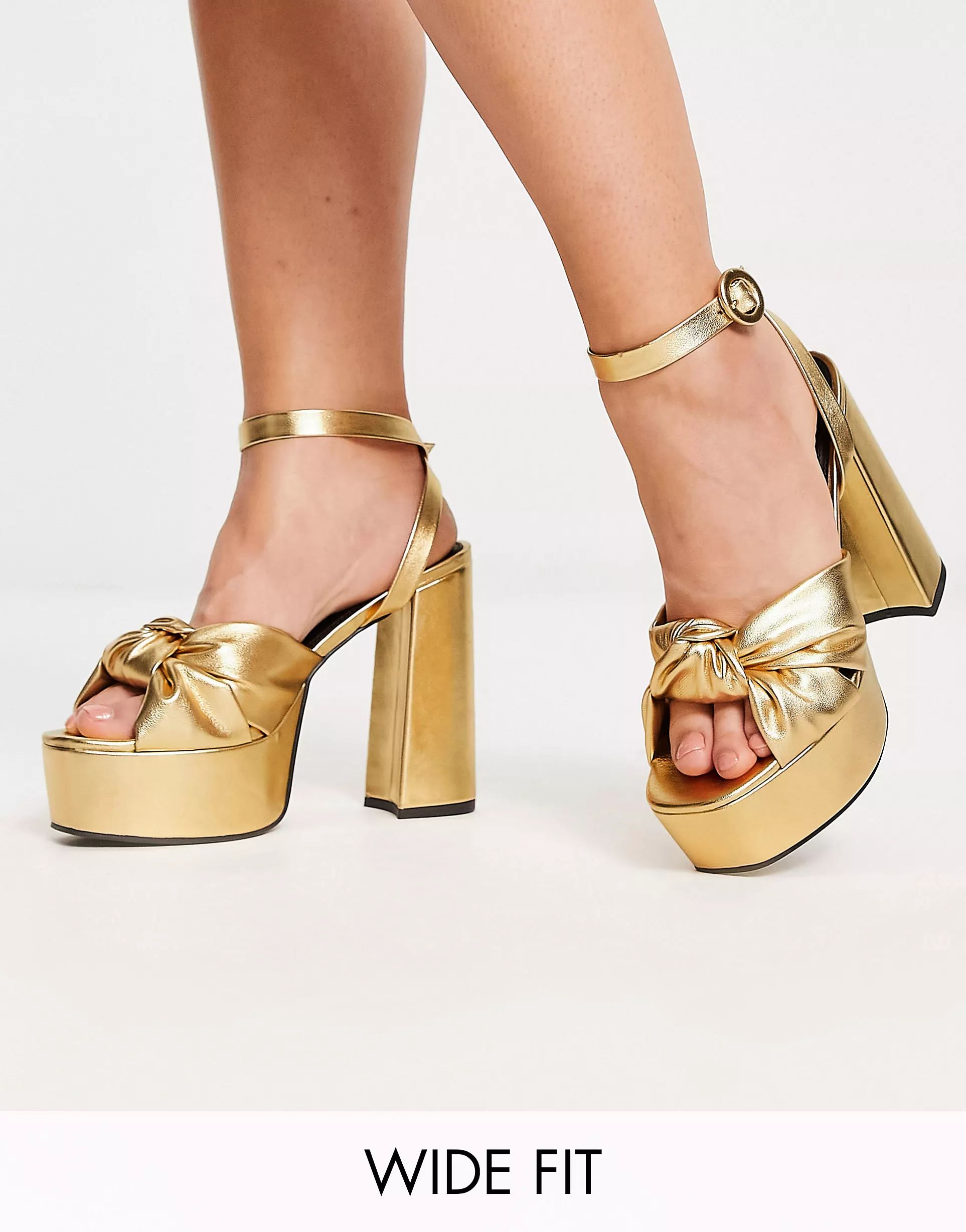 ASOS DESIGN Wide Fit Natia knotted platform heeled sandals in gold | ASOS (Global)