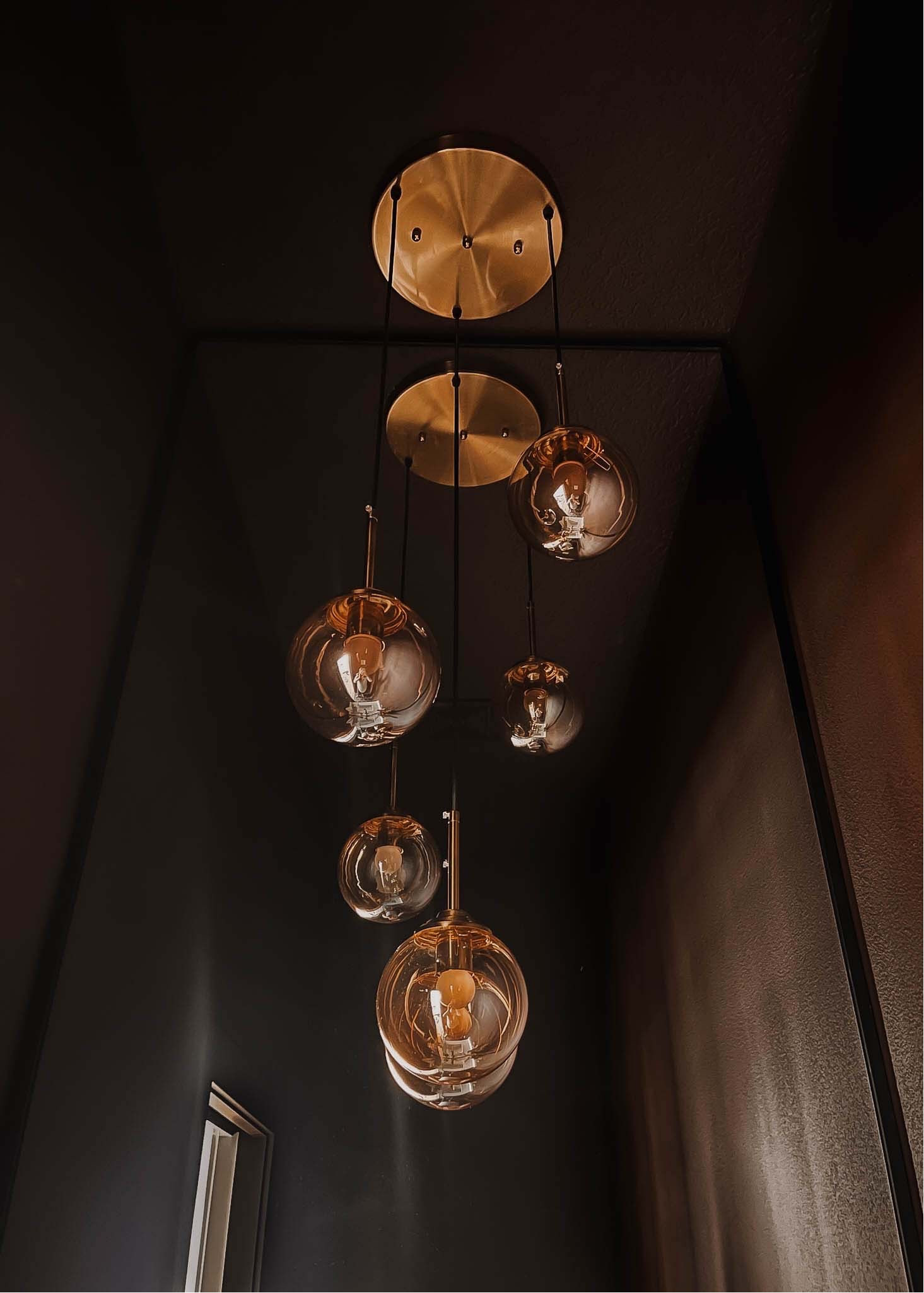 Chandelier lighting in my “Moody” powder room 

#LTKFindsUnder100 #LTKHome