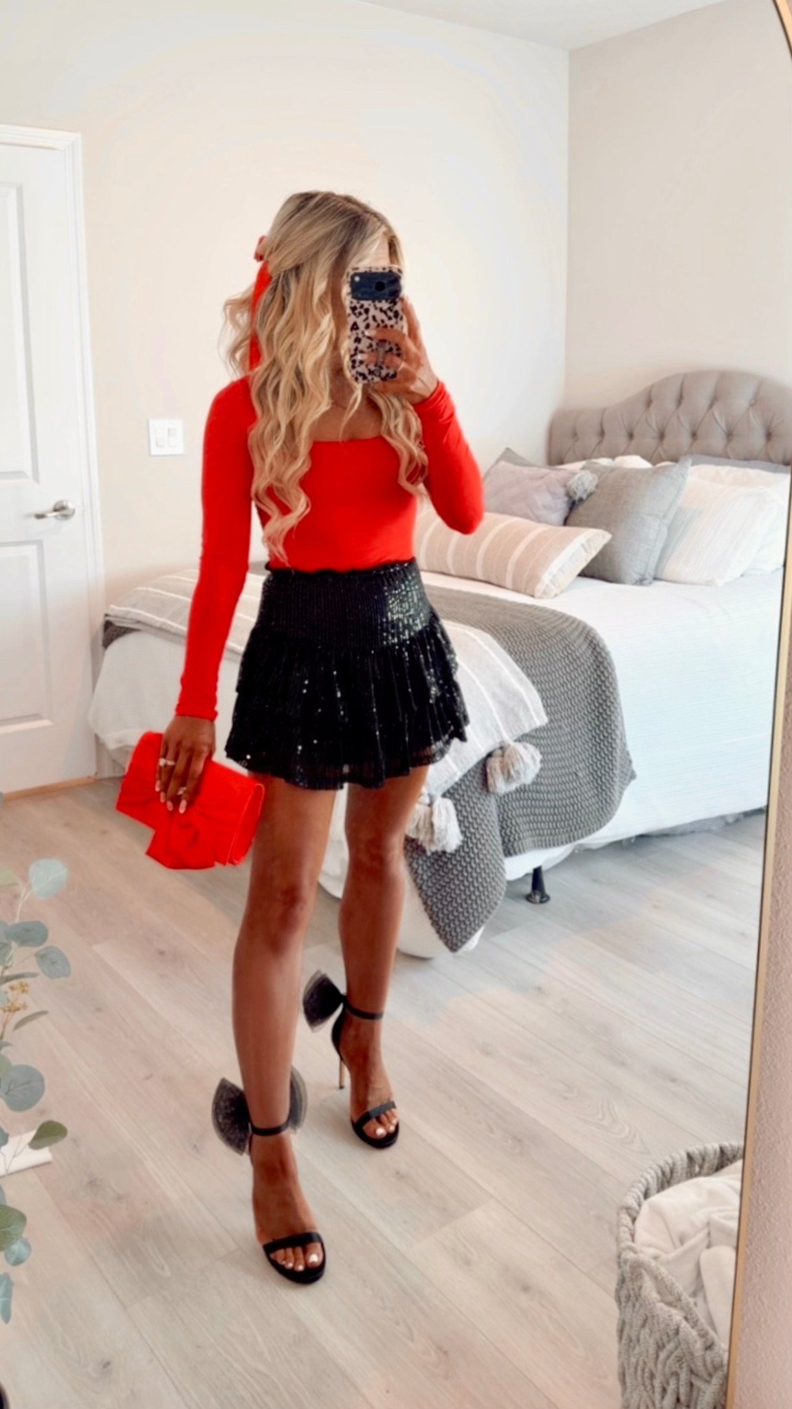 Holiday party outfit styled with a black sequin skirt, bright red top, bow heels, + a matching red satin bow clutch. 

Holiday outfit, Christmas outfit, Christmas party outfit, sparkly skirt, holiday skirt, holiday heels, sequin mini skirtt


#LTKHoliday #LTKootd #LTKSaleAlert