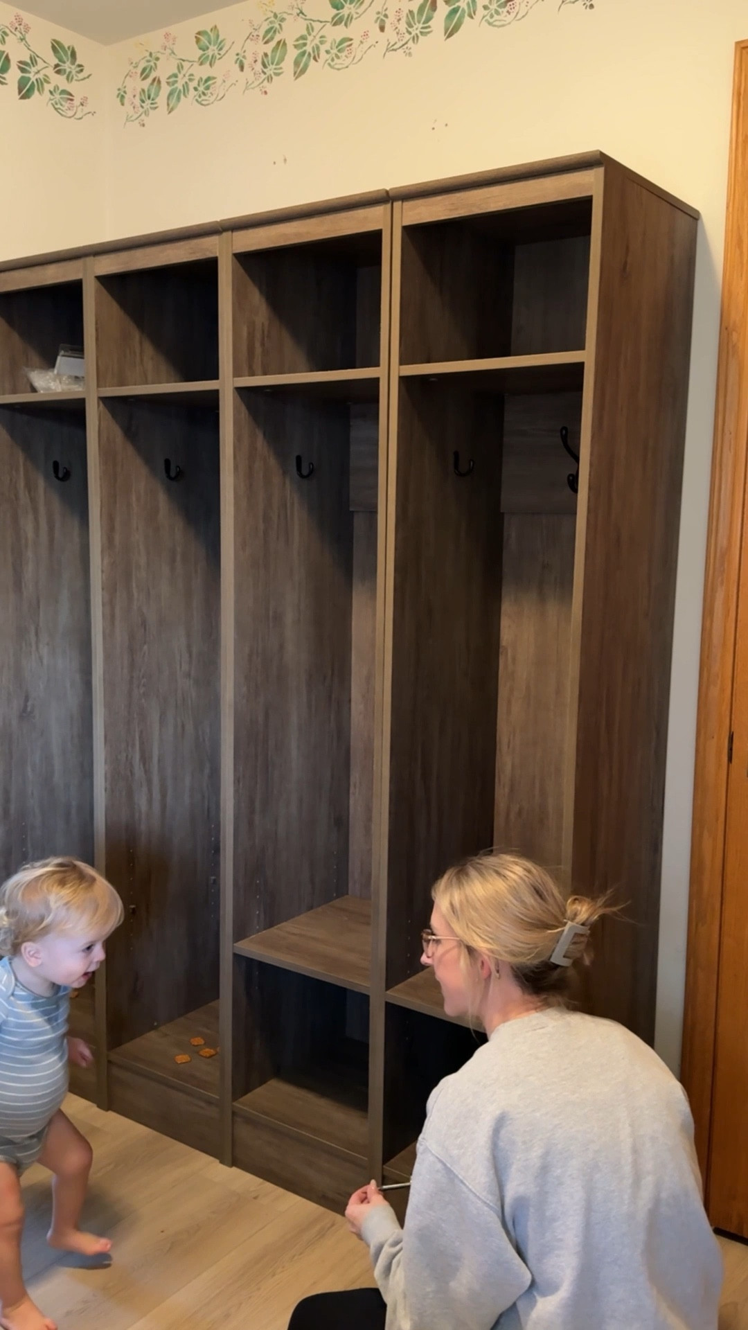 The cutest locker hall tree from wayfair and an even cuter helper getting them set up! Love the wood tone! 

#LTKHome