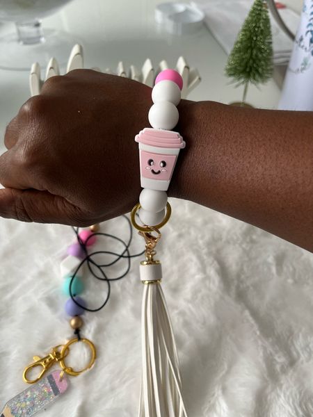This white and pink bracelet is both cute and functional! It easily attaches both your keys and wallet to your wristband. The coffee cup detail adds a nice touch!
#giftideasforteachers #lanyardlovebirds #affordablegifts #coffeelover

#LTKstyletip #LTKGiftGuide