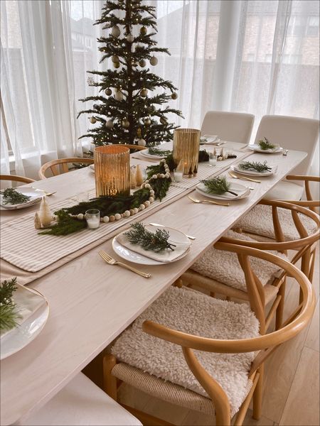 Love these new boucle seat cushions I added from H&M!! Made it so cozy for Christmas dinner! Poly and bark dining chairs. Lulu & Georgia oak dining table with travertine. King of Christmas tree  

#LTKhome #LTKHoliday #LTKSeasonal