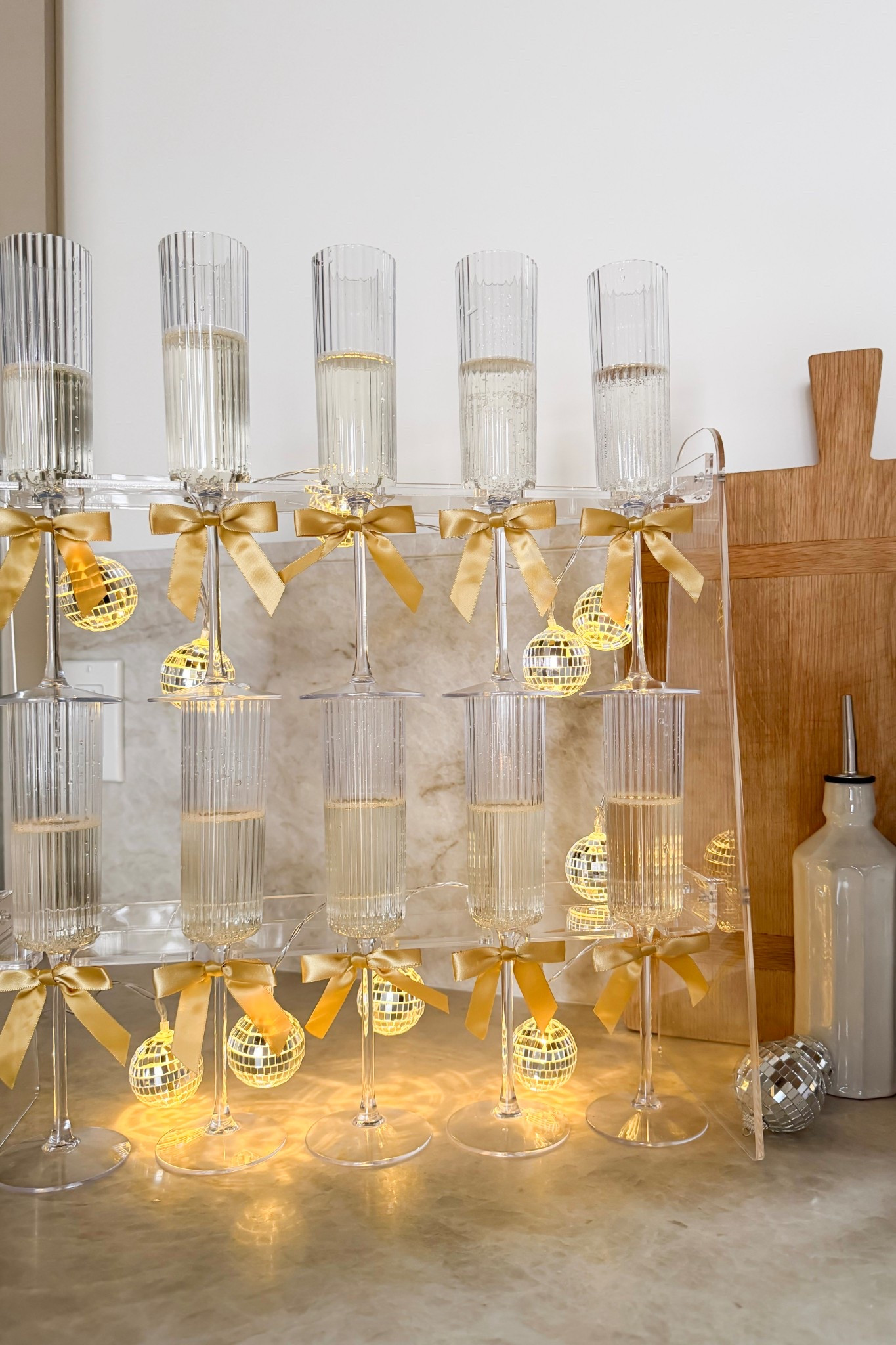 Festive way to serve champagne at your NYE party!

Party, party glass, bows, gold bows, champagne flutes, NYE, new years, new year's eve, new year's eve party, disco ball, light up decor

#LTKfoodie #LTKSeasonal #LTKHoliday