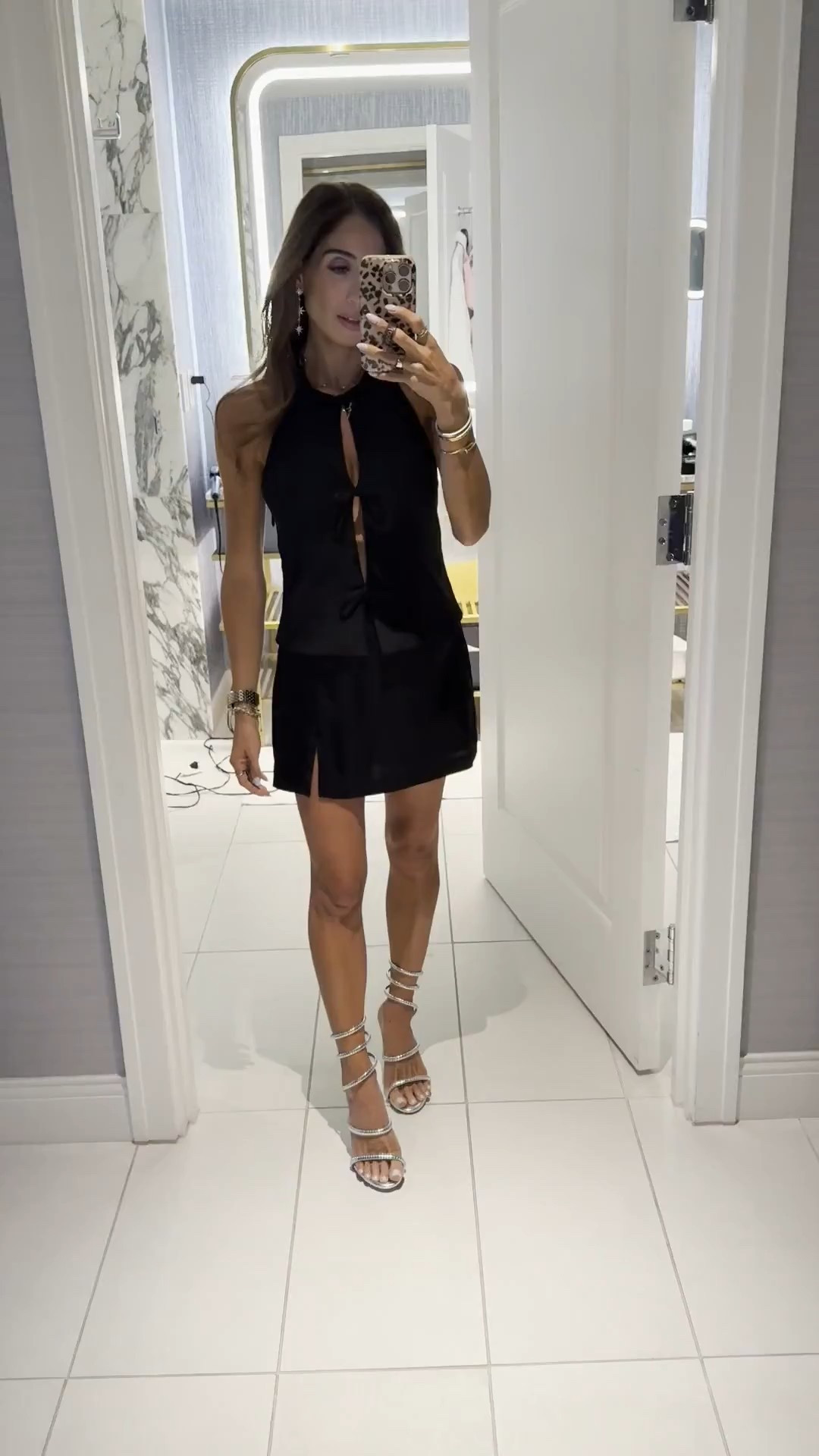Outfit idea date night Vegas. Amazon silver designer look for less heels. Halter bow top in sale code DENIMAF

#LTKSaleAlert #LTKPetite #LTKFindsUnder50