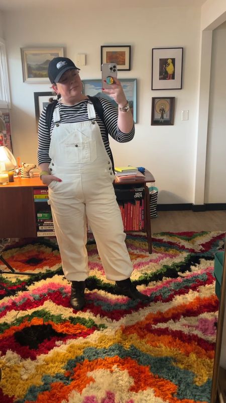 A rainy and gloomy day I tried to brighten with winter white overalls from Quince (XL) with a Universal Standard Breton stripe top (S). I tucked the hems into my waterproof boots for a different effect, put my hair in two braids and added my trusty North Face trucker cap. My commuter backpack is the large version and I highly recommend it. 

#LTKover40 #LTKmidsize #LTKstyletip