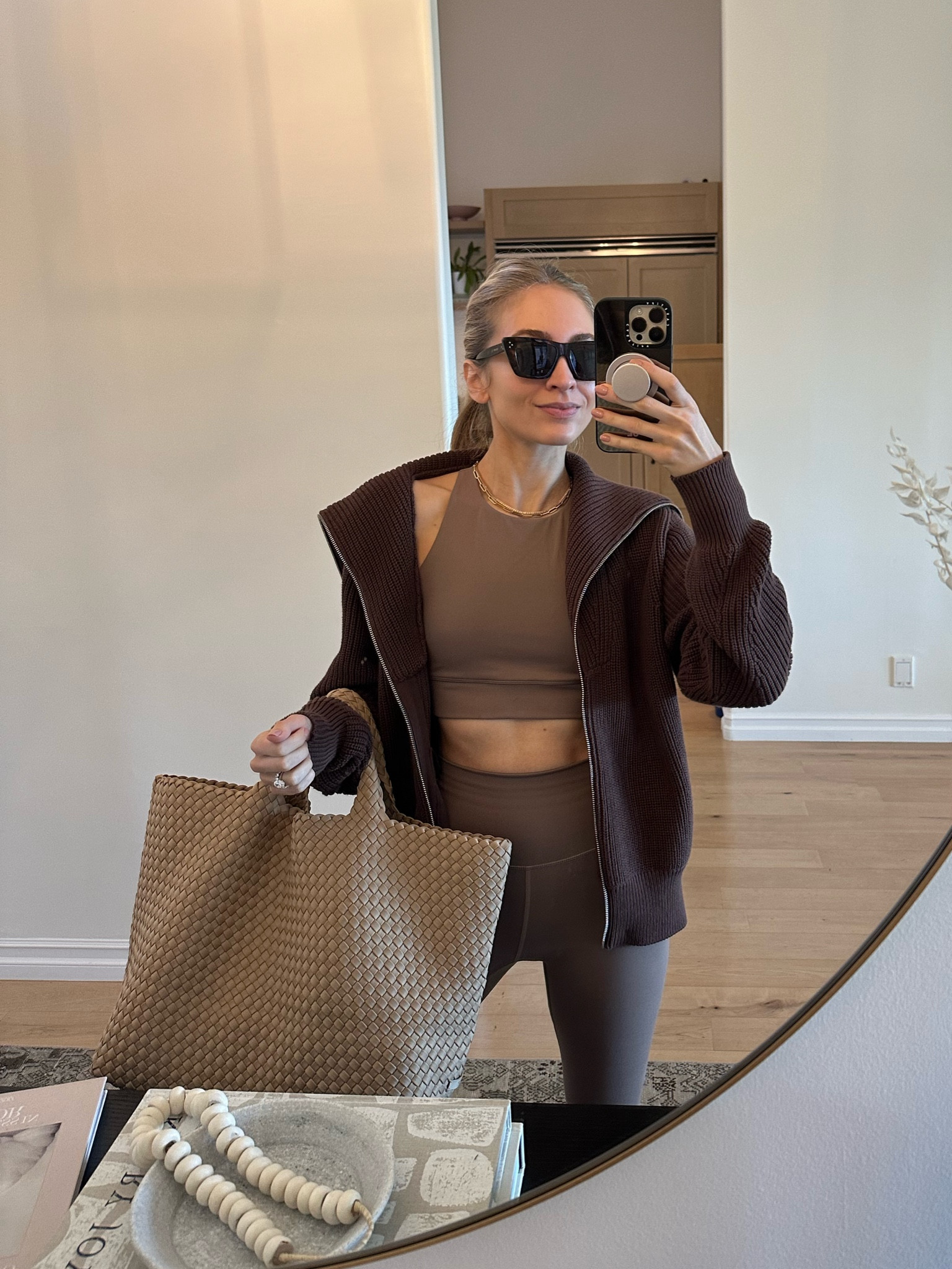 OMW to workout this AM 🐻 wearing a zip up chocolate brown Varley knit sneaker and a matching brown workout set. I’ve been throwing all my stuff into this large neoprene tote bag all week!

Sizes worn here:
Sweater XS (TTS)
Top XS (TTS)
Bottom XS (TTS)

#LTKfitness #LTKCyberWeek #LTKSeasonal