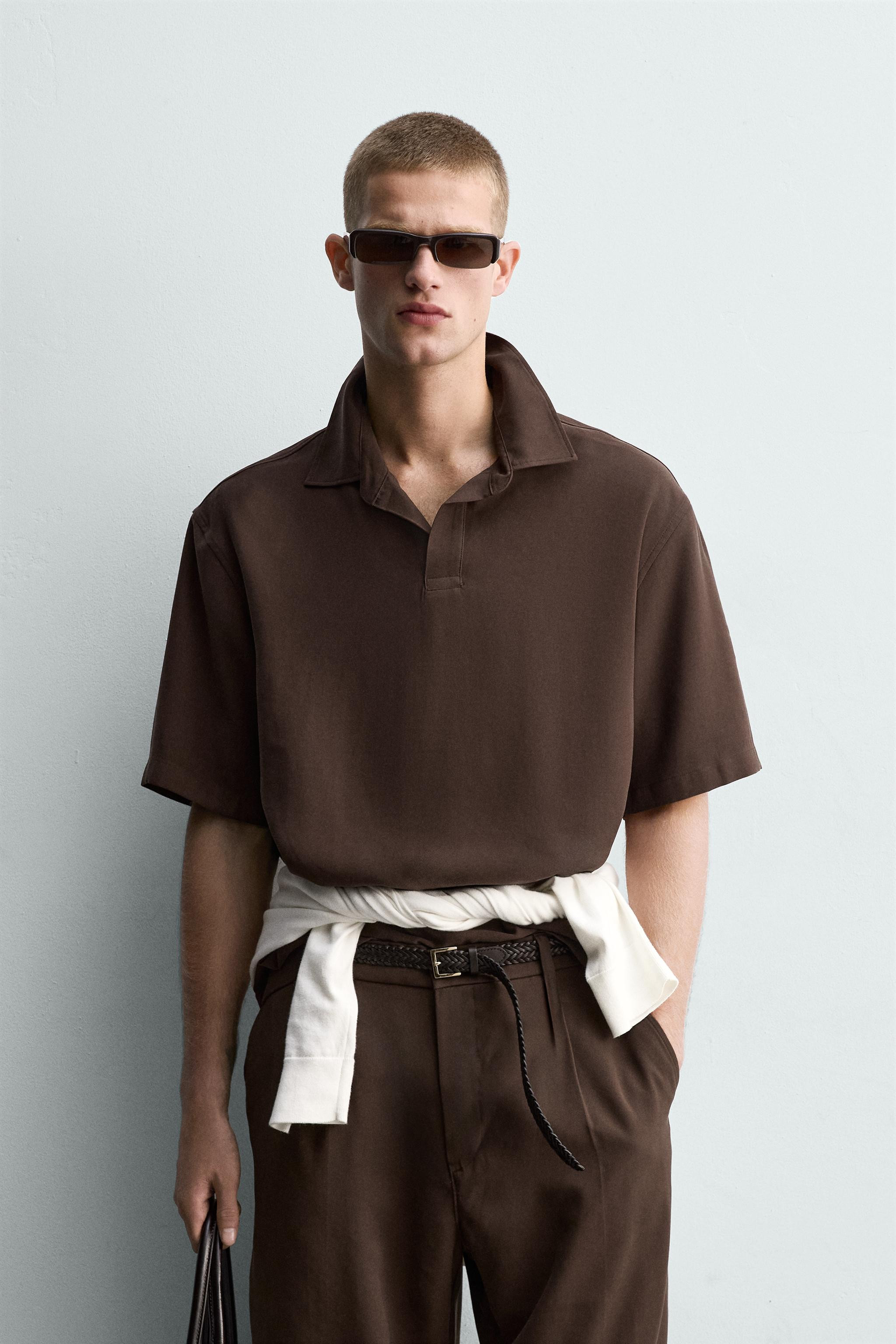 Relaxed fit polo shirt made of flowy viscose blend fabric. Lapel collar with hidden front button ... | Zara US