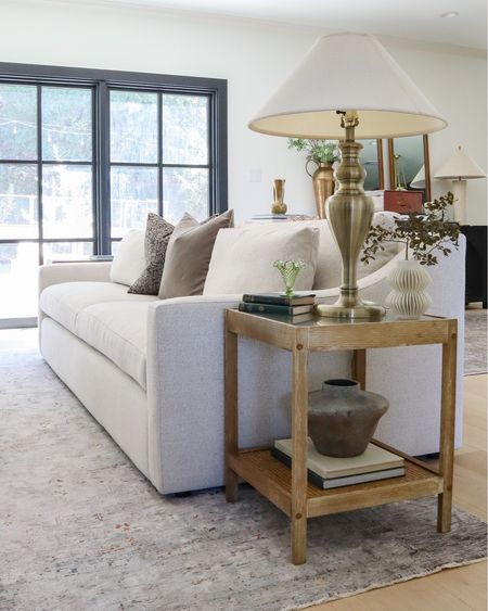 Curved arm Ashby Arhaus neutral sofa, wood rattan side table, living room rug

#LTKhome #LTKstyletip #LTKsalealert