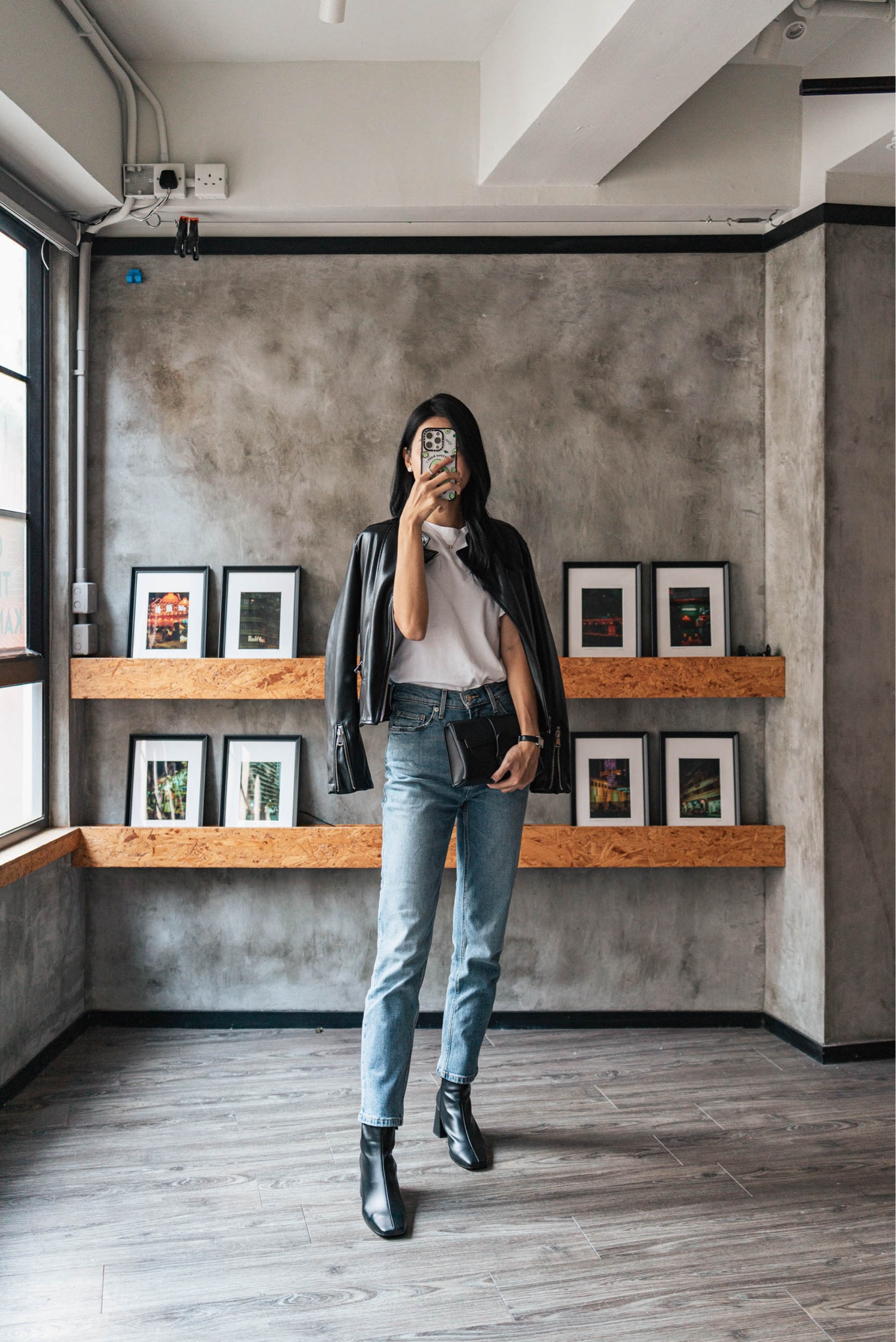 Capsule wardrobe OOTD wearing faux leather jacket, Uniqlo white tee, Everlane blue straight-leg denim, ALOHAS black faux leather ankle boots, Senreve black Aria bag, Casetify Ketnipz phone case. Hair styled with GHD.

#LTKAsia #LTKstyletip #LTKshoecrush