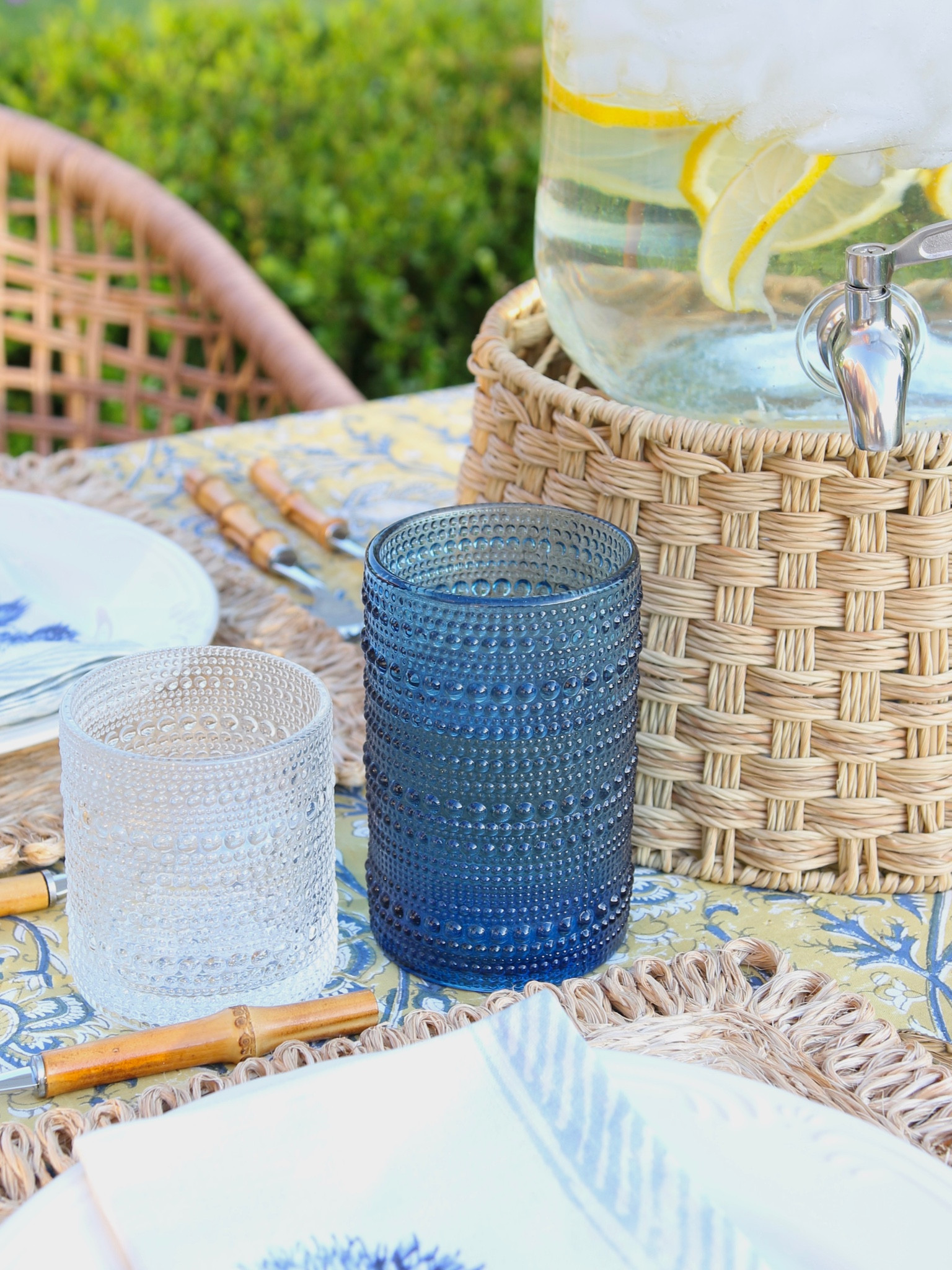 Patio decor, beaded drinking glass, block print tablecloth, cloth napkin, bamboo flatware set, woven placemat, glass beverage dispenser, rattan beverage dispenser stand

#LTKstyletip #LTKFind #LTKhome