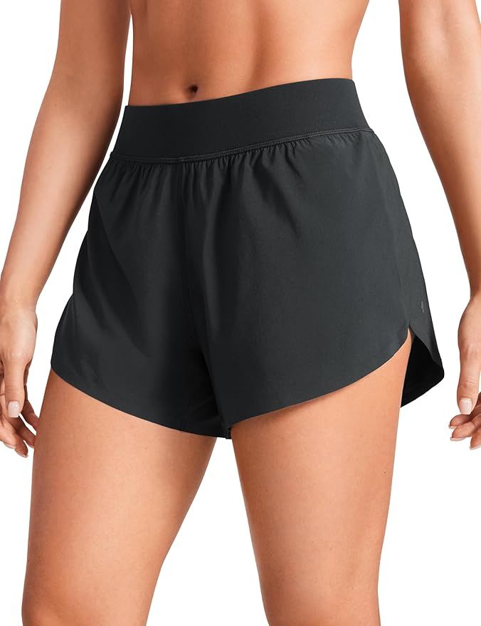 CRZ YOGA Mid Waisted Dolphin Athletic Shorts for Women Lightweight High Split Gym Workout Shorts ... | Amazon (US)