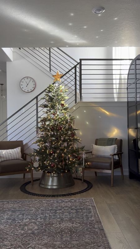 This Christmas tree has been such a favorite for us for the last few years. I love the realistic sparser look and the mixed branches. It’s pre-lit and super easy to assemble, and a great price too. 

Also highly recommend adding daytime sparkle with a disco ball ornament in the path of a window. 🪩 

#LTKhome #LTKHoliday #LTKSeasonal