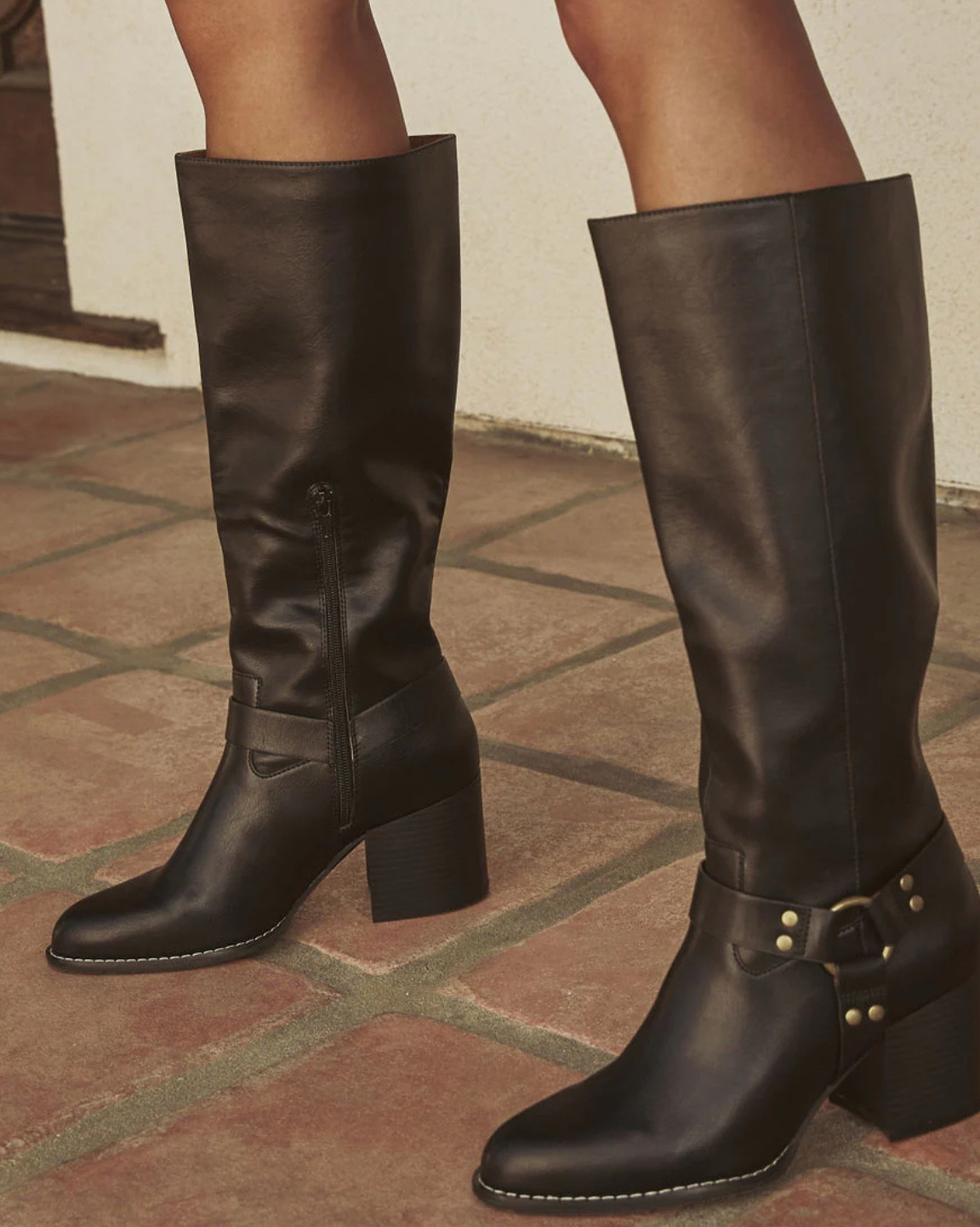 Hit the road in style with the Scenic Route Western Buckle Knee High Boots. These boots are a perfect blend of Western charm and Bohemian spirit. With a sleek buckle accent at the side and a smooth zipper closure, they offer both flair and functionality. Crafted for those who love a touch of rugged elegance, the knee-high design pairs effortlessly with everything from flowing skirts to skinny jeans.

Heel Height: 2.75"
Shaft Height: 14.25"
Buckle accent at side
Zipper closure
True to size
Material: Faux leather

#LTKParties #LTKSaleAlert #LTKFallSale