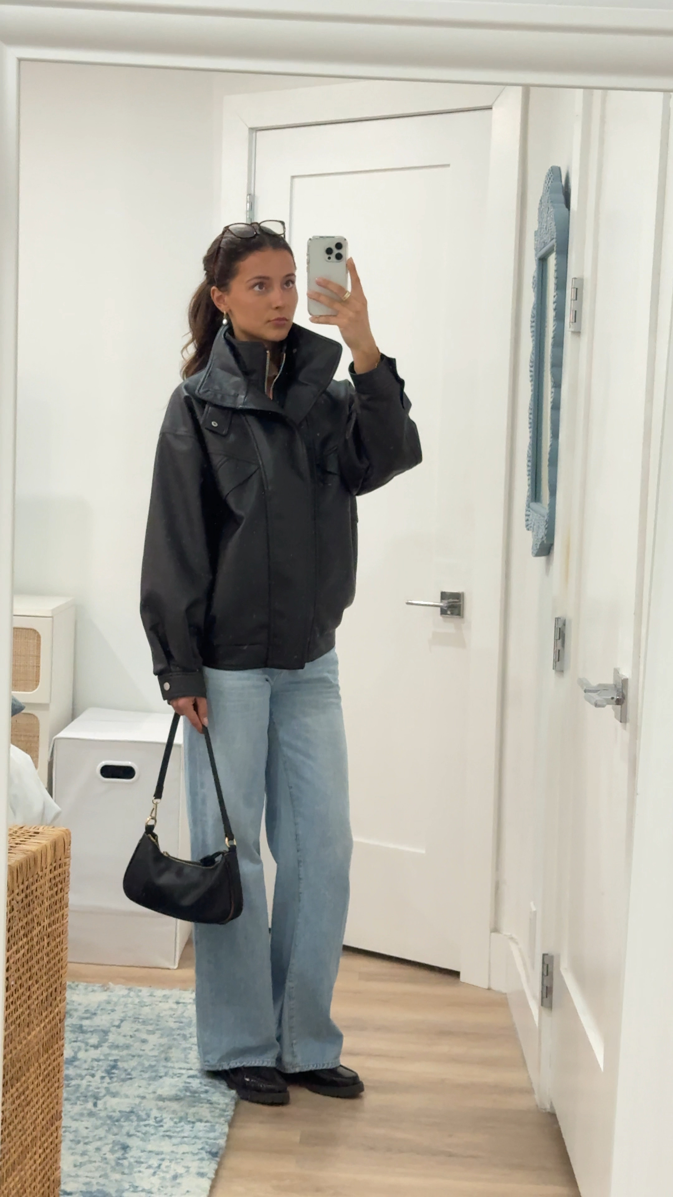 NYC day time shopping look. High neck leather jacket and the perfect blue jeans. Loafers elevate any look  