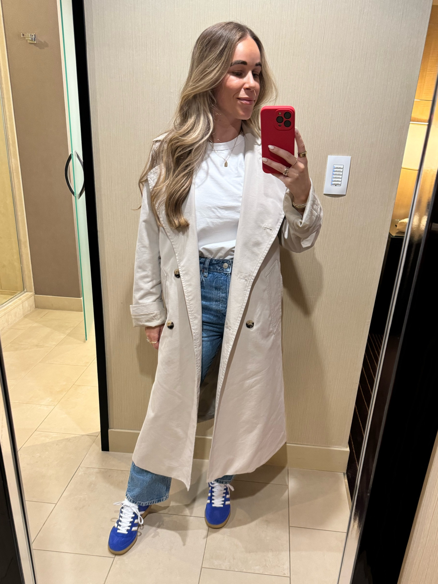 Casual outfit. Trench coat. White tee. Light wash jeans. Cropped jeans. Adidas sneakers blue  