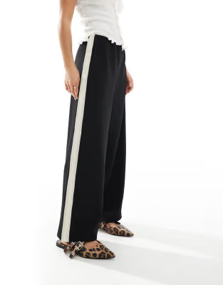 Vero Moda Petite loose pull on trousers with side stripe in black | ASOS (Global)