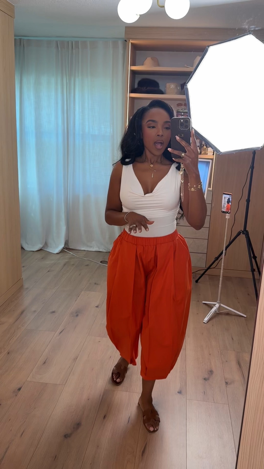 Color that does the talking ❤️‍🔥 These bold red wide-leg trousers paired with a fitted neutral tank create that effortless contrast that always works. The high waist and flowy silhouette elongate the legs, and when styled multiple ways — heels for dinner, sandals for daytime — the cost per wear keeps dropping.

The soft cream top keeps it balanced while the statement pants bring all the energy. It’s an easy formula you can recreate with pieces already in your closet.

Perfect for: brunch, vacation outfits, date night, rooftop drinks, summer events, and elevated everyday style.

📏 Sizing:
Wearing size Small in the top  
Wearing 4 Long in the pants  

📐 Measurements:
5’4” · 138 lbs · 34D · 27” waist · 40” hips  

Favorite this to restyle later.

This post includes red trousers outfit, statement pants, wide leg pants outfit, vacation outfits beach, summer date night looks, bold color styling, high waisted trousers, and chic minimal tops.

Follow me on Instagram and YouTube @kirasfashionfinds