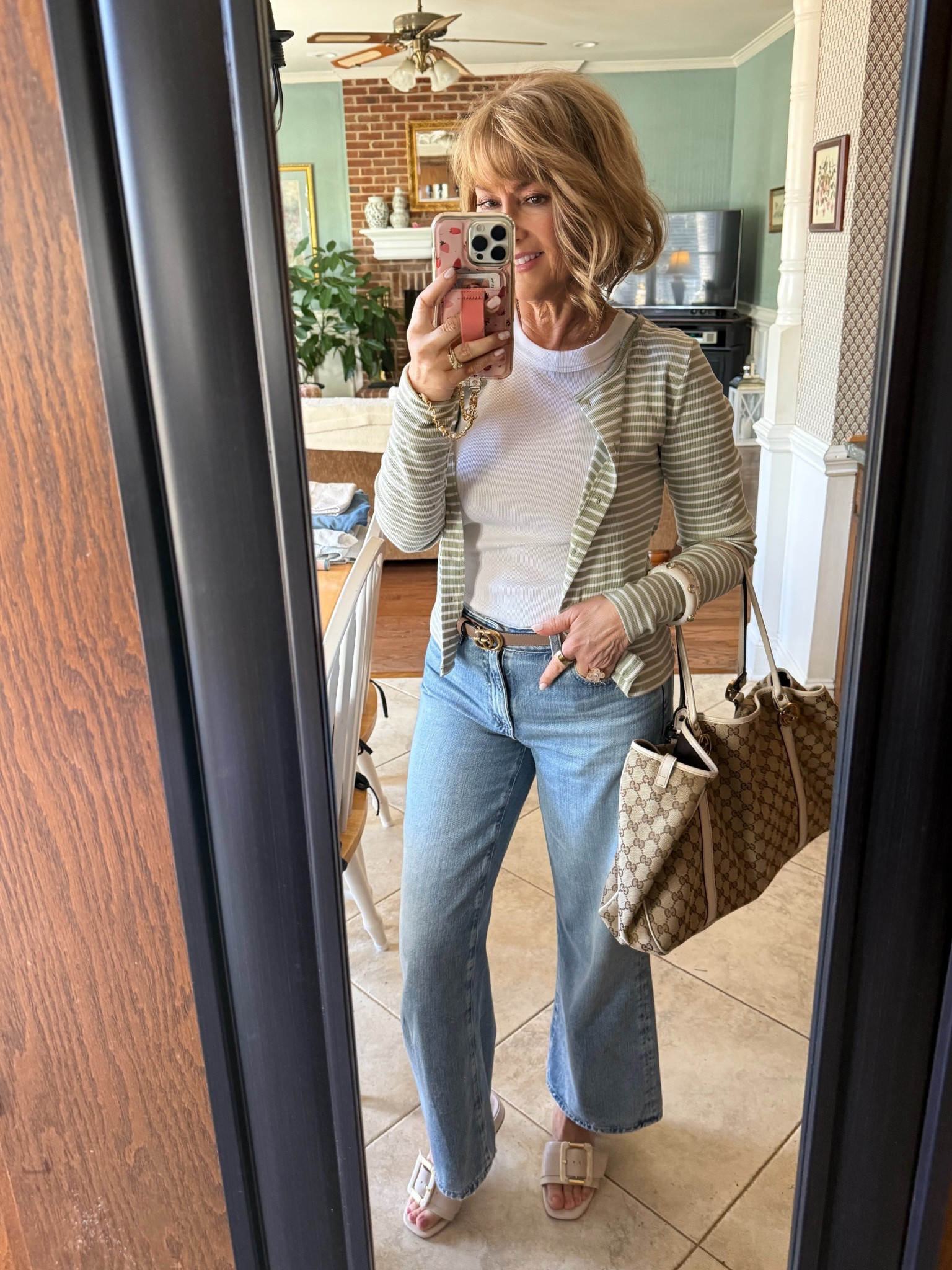 Scalloped green and white tiny striped cardigan and white tee. Love these new buckle slides with a low block heel. Looks equally good with dresses too. 


#LTKSaleAlert #LTKOver40 #LTKSeasonal