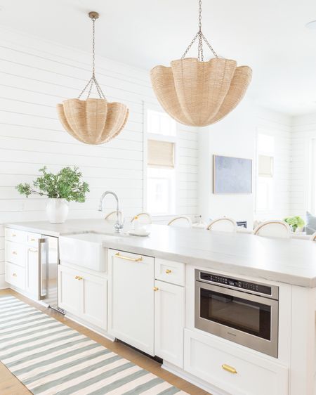 I added this favorite striped rug to our kitchen for spring because I’ve loved the look so much in other sizes in the past!. Also linking my scalloped pendant lights, swivel counter stools, woven Roman shades, faux greenery and white ceramic vase. Many items in our coastal kitchen are currently on sale!
.
#ltkhome #ltksalealert #ltkfindsunder50 #ltkfindsunder100 #ltkstyletip #ltkseasonal coastal decor, kitchen decor, spring decorating 

#LTKhome #LTKsalealert #LTKSeasonal