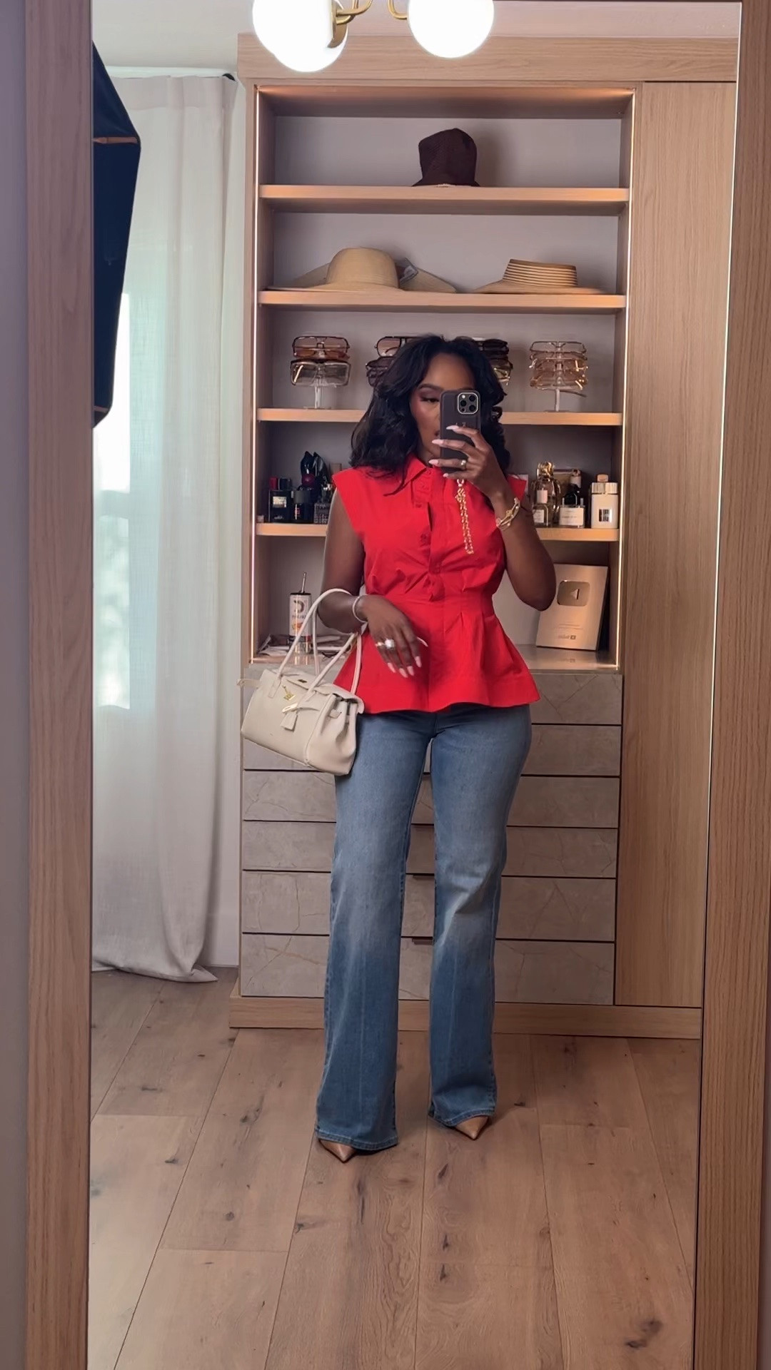 Hi babes! ❤️

Okay this red structured top is SUCH a statement piece without needing a lot. The tailored waist detail gives that snatched look instantly, and pairing it with classic straight-leg denim keeps the outfit feeling polished but still super wearable for everyday.

This is exactly the type of affordable hero piece that makes simple jeans feel elevated. Added the creamy mini bag + neutral heels to soften the bold red and give it that expensive, luxury-inspired styling moment without overdoing it.

A good statement top like this is always worth it because you can style it with denim, trousers, white pants, shorts, or skirts year-round. Cost per wear ends up being SO good on pieces that instantly make an outfit look styled.

Where to wear this:
• Lunch dates
• Casual office days
• Dinner nights
• Weekend outings
• Brunch with the girls
• Vacation dinners
• Casual events

Everything is linked below ✨

xx Kira | IG: KirasFashionFinds

5’4 | 140LBS | 34D-27-40 | size small | jeans 27