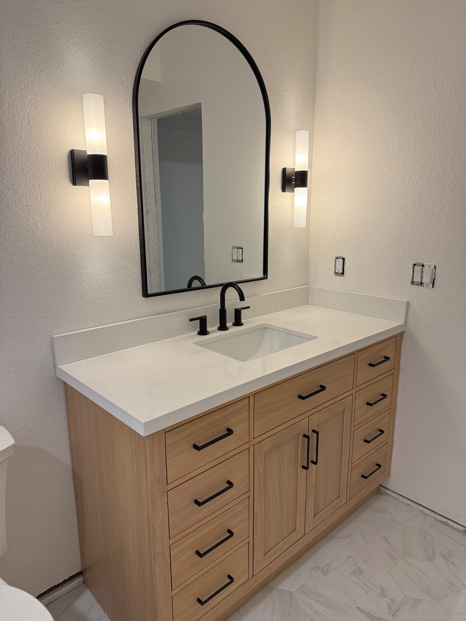 Our basement bathroom is looking so good! Linking my vanity, lights, mirror, and tile 

#LTKHome #LTKSaleAlert #LTKStyleTip