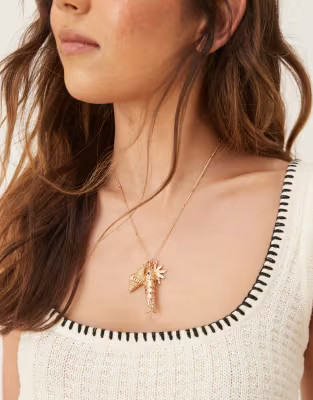 Accessorize fish charm pendant necklace in gold | ASOS | ASOS (Global)